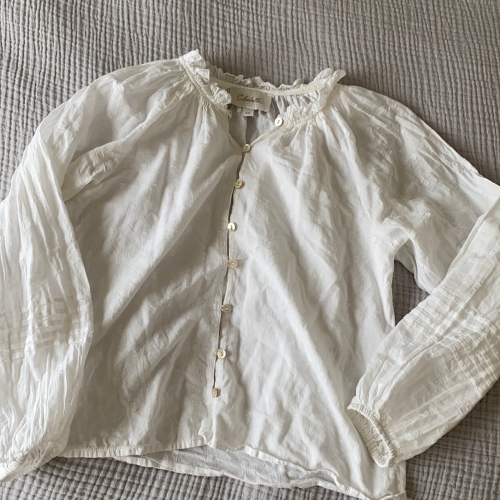 White blouse with ruffle collar